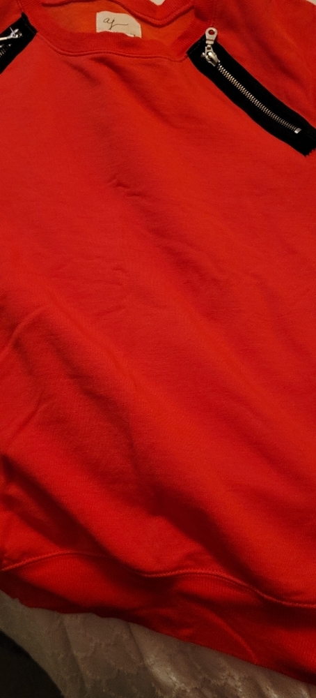Andrea Jovine Orange Sweatshirt with black zipper details.